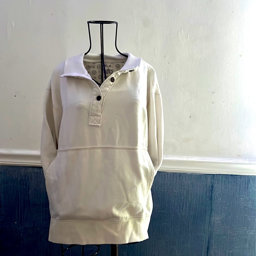 Cream pull over. Has not been worn